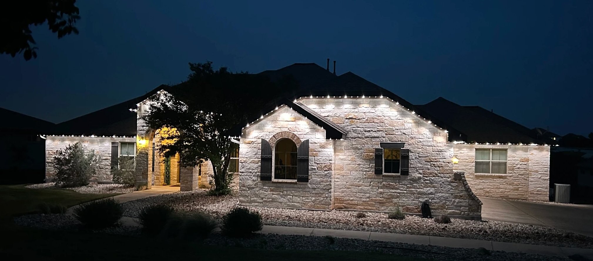 Arthur A.'s home with crisp white roofline lighting