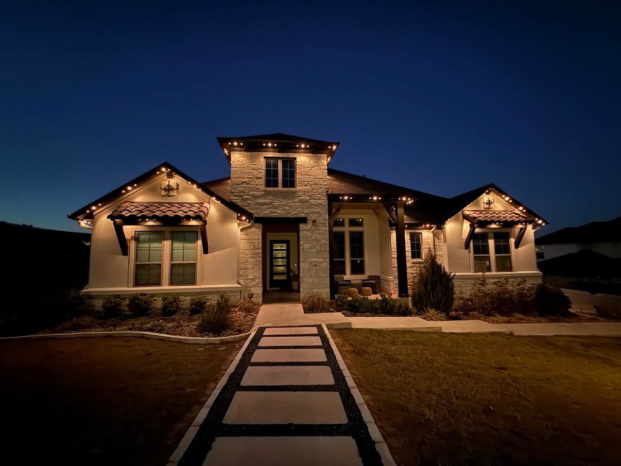Permanent LED trim lights in warm white on a single-story Austin home — installed by Zeus Illumination